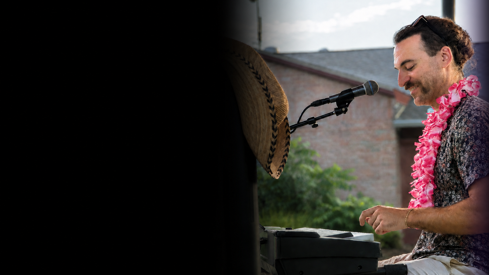 Matt Mueller playing piano at a live show